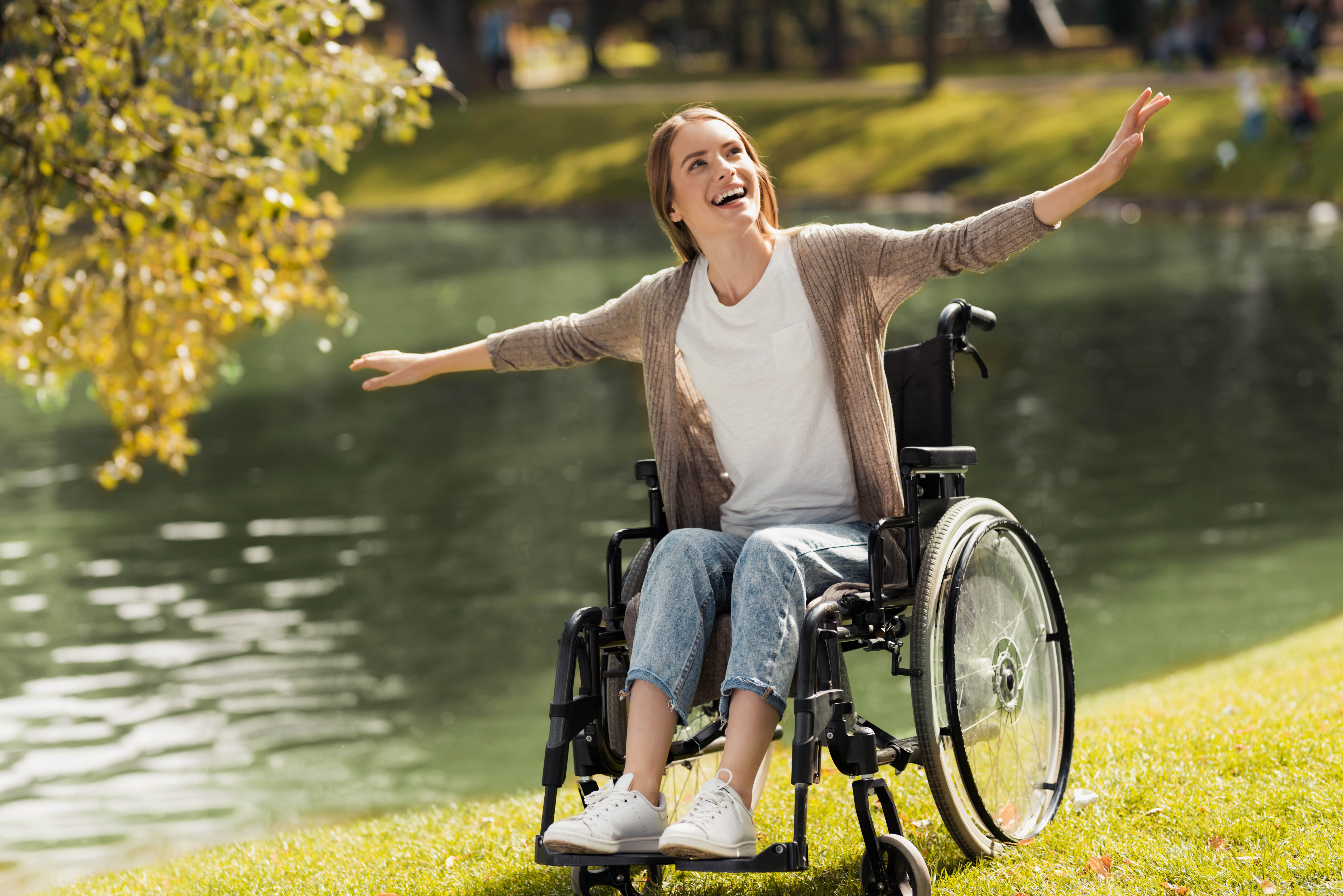 A woman using a wheelchair enjoying time outdoors